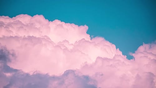 Pink Clouds Floating in a Dreamy Blue Sky