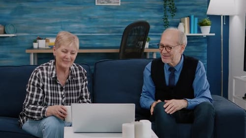 Senior Couple Video Chatting at Home
