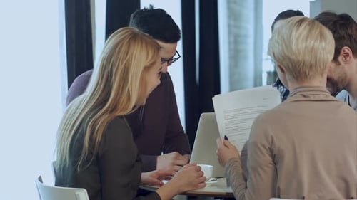 Collaborative Team Working Together in Modern Office