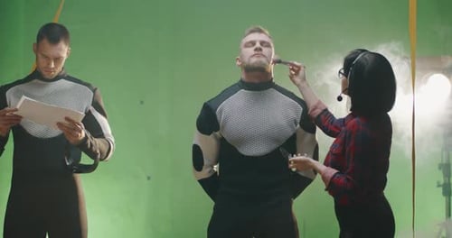 Makeup Artist Applying Makeup to Actor on Set