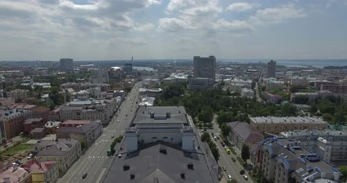 An Aerial View of a Sunny Urbanscape Near the Large River