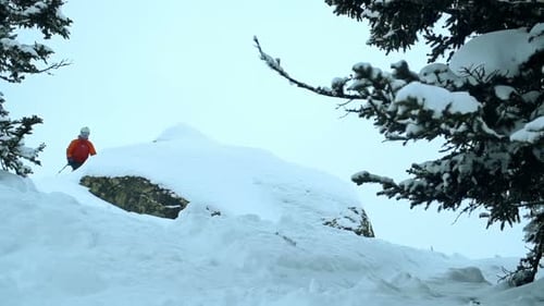 Skier Does Trick Off Snowy Ledge