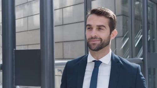 Businessman Checking Watch And Smiling