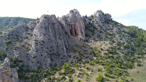 Rocky mountain and cave.