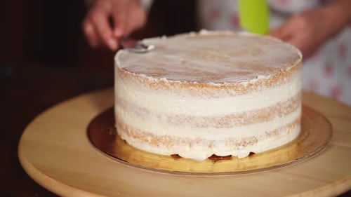 Close Up Shot of the Sand Cakes From the Cake, Which the Chef Smears Creamy