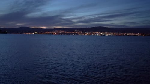 Night Cityscape Reflecting on Calm Water