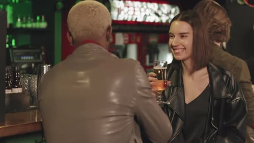 Multi-Ethnic Couple Chatting At Bar