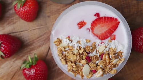 Rotating Breakfast with Yogurt, Granola, with Superfood Toppings, the View From the Top. Concept of