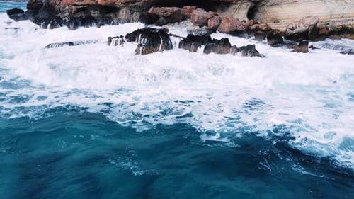 Ocean Waves Crash Against the Rocky Shore the Coastline of the Mediterranean Sea During a Storm