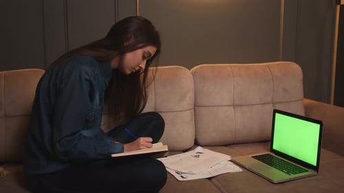 Portrait of Woman Calling Video on Laptop Green Screen Chromakey