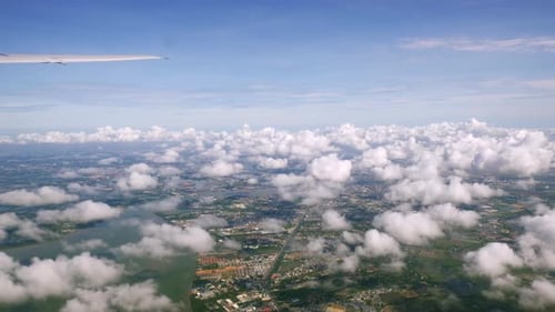 A view of the upper plane window while floating in the air, overlooking the mountains and natural wa