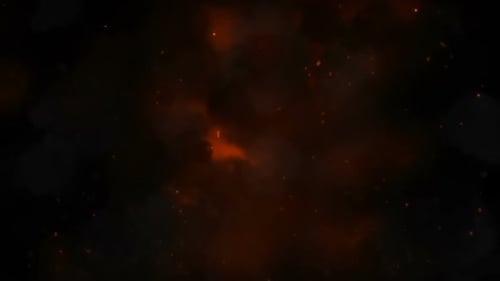 Burning red hot sparks rise from large fire in the night sky