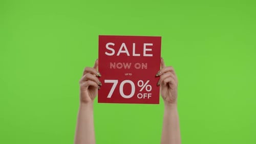 Sale Now On Up To 70 Percent Off Inscription on Paper Sheet in Womans Hands on Chroma Key
