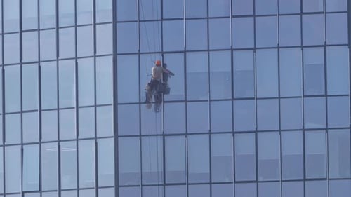 Climber Washes Windows in a Skyscraper