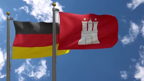 Germany And Hamburg Flags Waving In Blue Sky