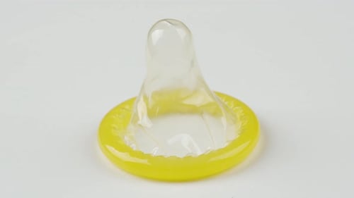 close up of condom rotating