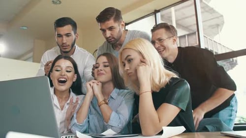 Enthusiastic Team Celebrates Success Together in Modern Office