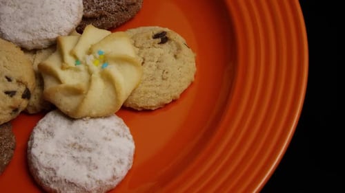 Close Up of Assorted Cookies on Orange Plate