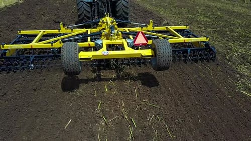 Tractor Working In The Agricultural Field