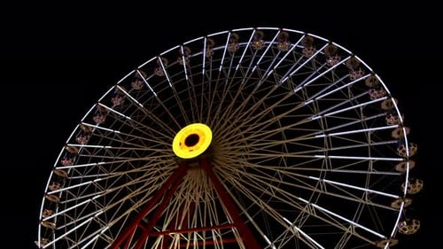 Ferris Wheel In Amusement Park At Night