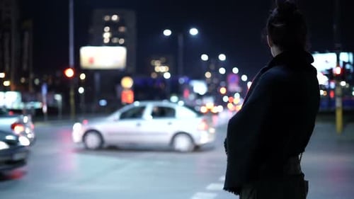 Woman Waits at a Bus Stop at Night, People Stock Footage ft. waiting & urban - Envato