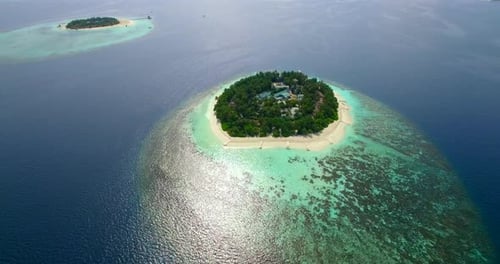 Aerial drone view of scenic tropical islands in the Maldives.
