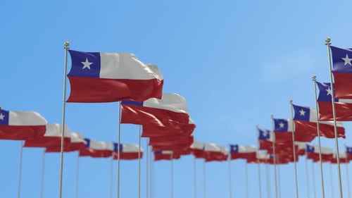 Chilean Flags Waving Against Blue Sky