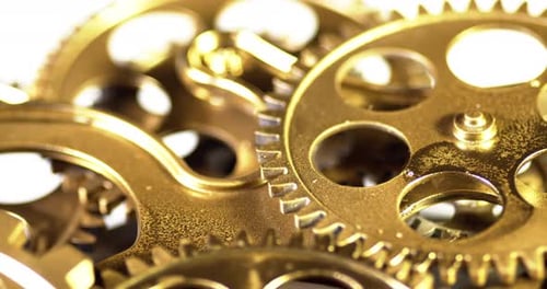 Gold Gears Turning in Extreme Close Up