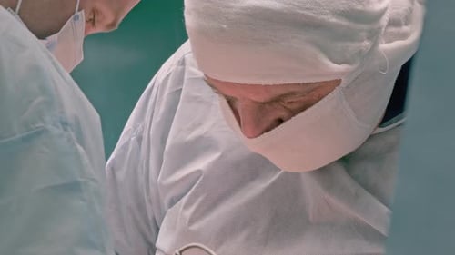 Surgeons Performing Operation in Hospital Operating Room