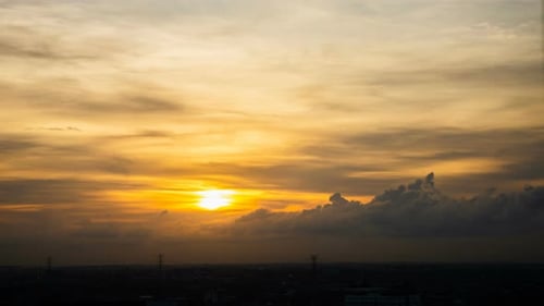 City Sunrise Time Lapse: Golden Sky Over Urban Silhouette