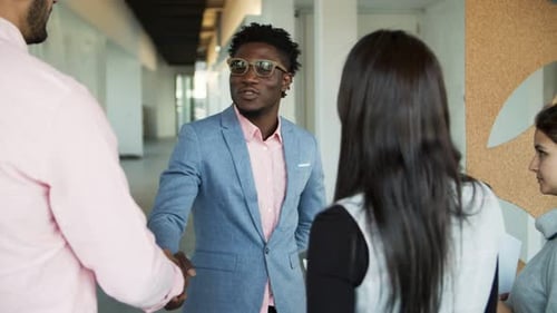 Business People Handshake in Modern Office