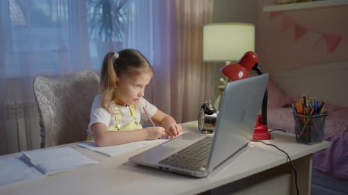 Girl Studies With Laptop At Her Desk
