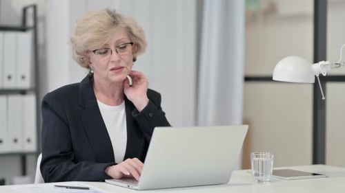 Blonde Woman Working in Office Typing on Laptop