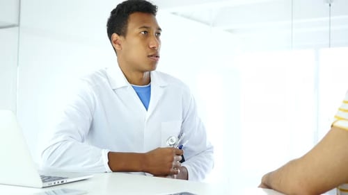 Doctor Examining Patient with Stethoscope in Modern Clinic
