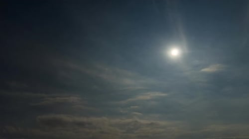 Rolling Clouds and a Full Moon at Night