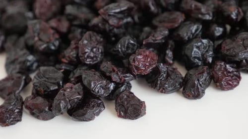 Pile of Dried Cranberries on White Surface