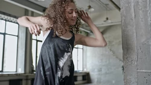 Woman Dancing Gracefully in an Urban Studio