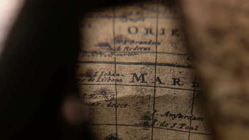 Close Up of Vintage Map Through Magnifying Glass