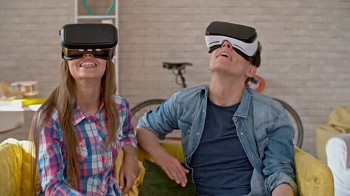 Friends Laughing While Using Virtual Reality Headsets