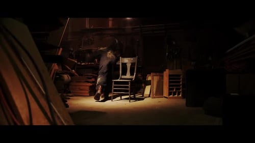 Figure Works in Dark, Mysterious Room