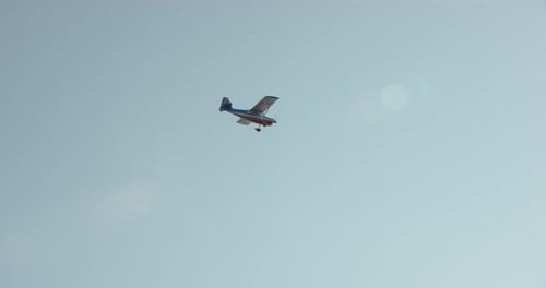 Aerial helicopter shot, push across rippling glacier at golden hour towards tall snowy mountains, ti