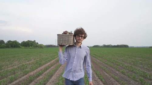 Young Adult Walking Through Rural Crop Field