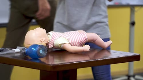 Infant CPR Demonstration on Baby Doll Mannequin