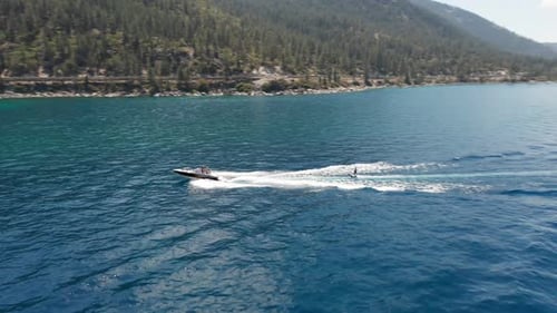 Wakeboarding Behind a Boat on a Lake