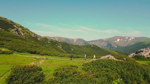 A Group of Tourists Climbing the Mountains From a Bird's Eye View