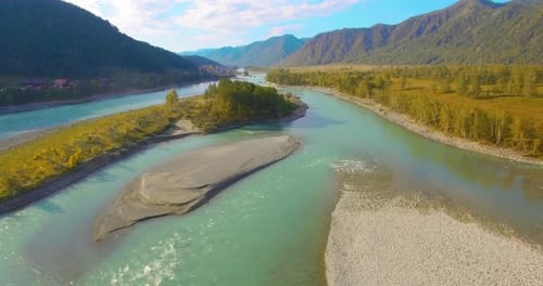 Low Altitude Flight Over Fresh Fast Mountain River with Rocks at Sunny Summer Morning