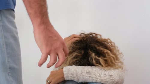 Vulnerable Woman Defending Herself from an Approaching Man