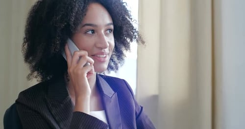 Smiling Woman Talking on Mobile Phone