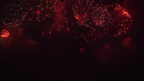 Spectacular Red and Gold Fireworks Exploding at Night