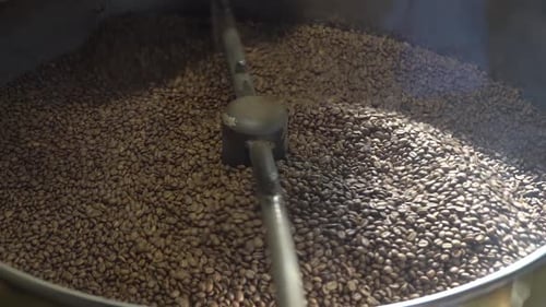 Coffee Beans Being Roasted in Mixing Machine